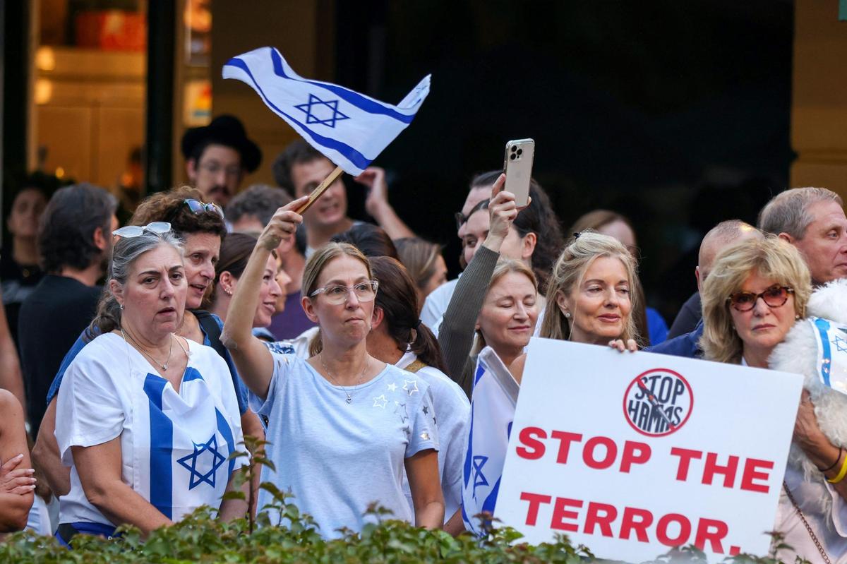 Attendees waved flags and held signs alongside members of the South Florida Jewish community and allies who gathered at the Waterways Shoppes in Aventura to support Israel in its war against Hamas on Monday, Oct. 9, 2023.