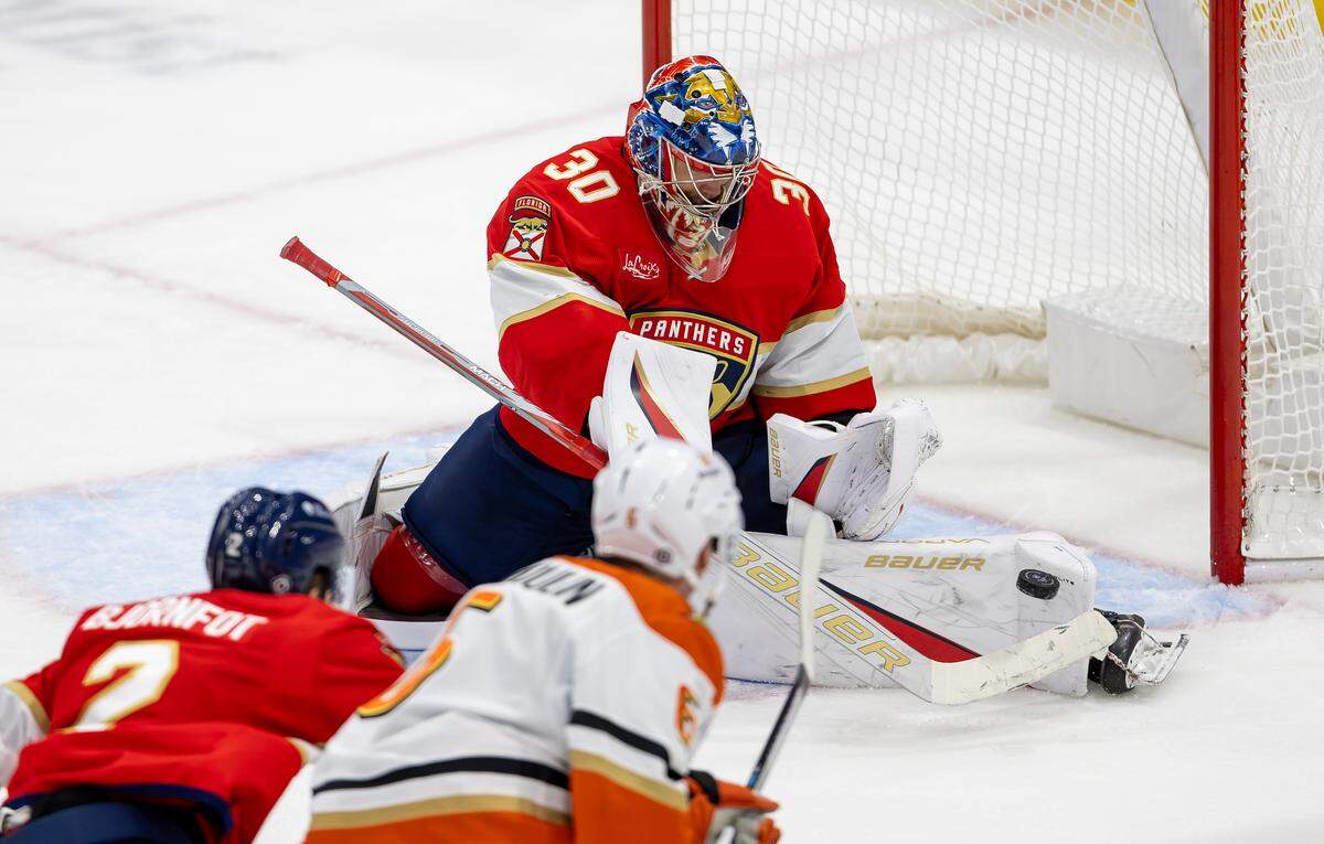 Florida Panthers goaltender Spencer Knight (30) makes a save against Anaheim Ducks defenseman Brian Dumoulin (6) during the third period at Amerant Bank Arena on Saturday, Jan. 18, 2025, in Sunrise, Fla.
