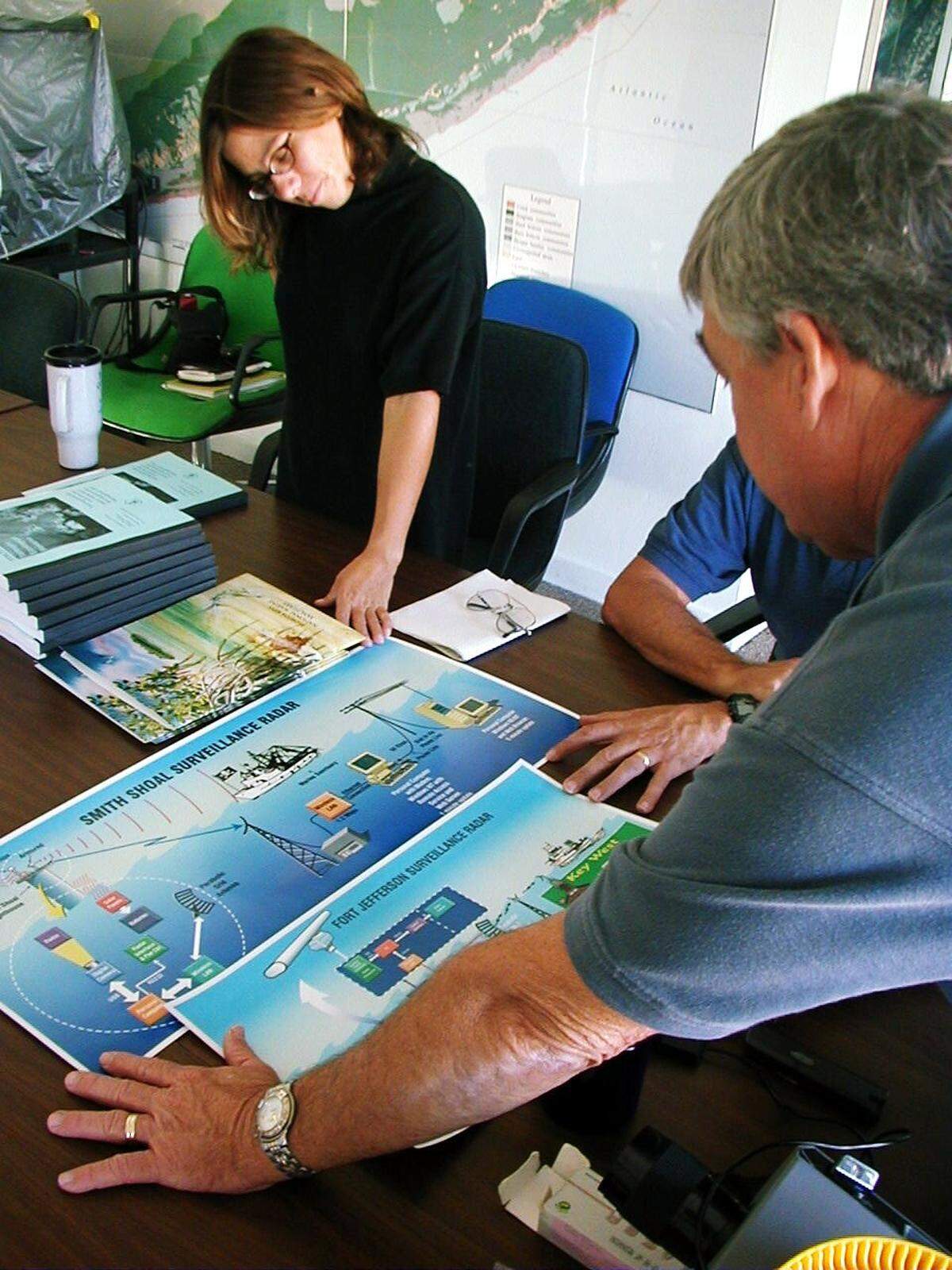 Billy Causey, then-superintendent of Florida Keys National Marine Sanctuary, and then-sanctuary spokeswoman Cheva Heck inspect plans for the enforcement of the proposed Tortugas Ecological Reserves in 2000.
