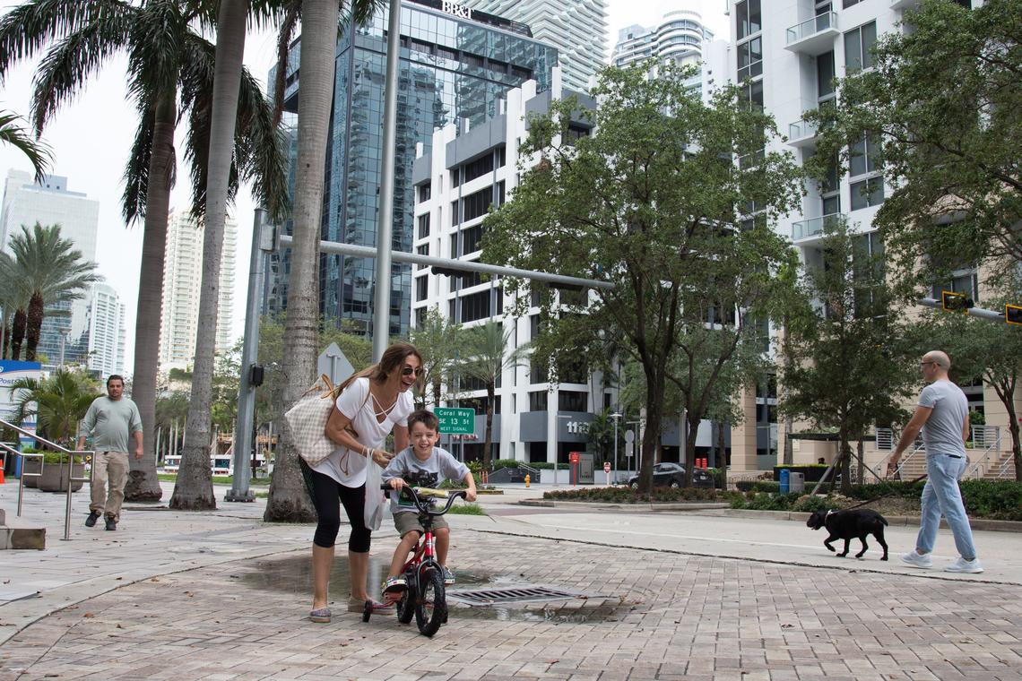 Brickell Resident Angie Salazar enjoys taking her grandson on a bicycle ride in Miami on Monday, May 28, 2018.