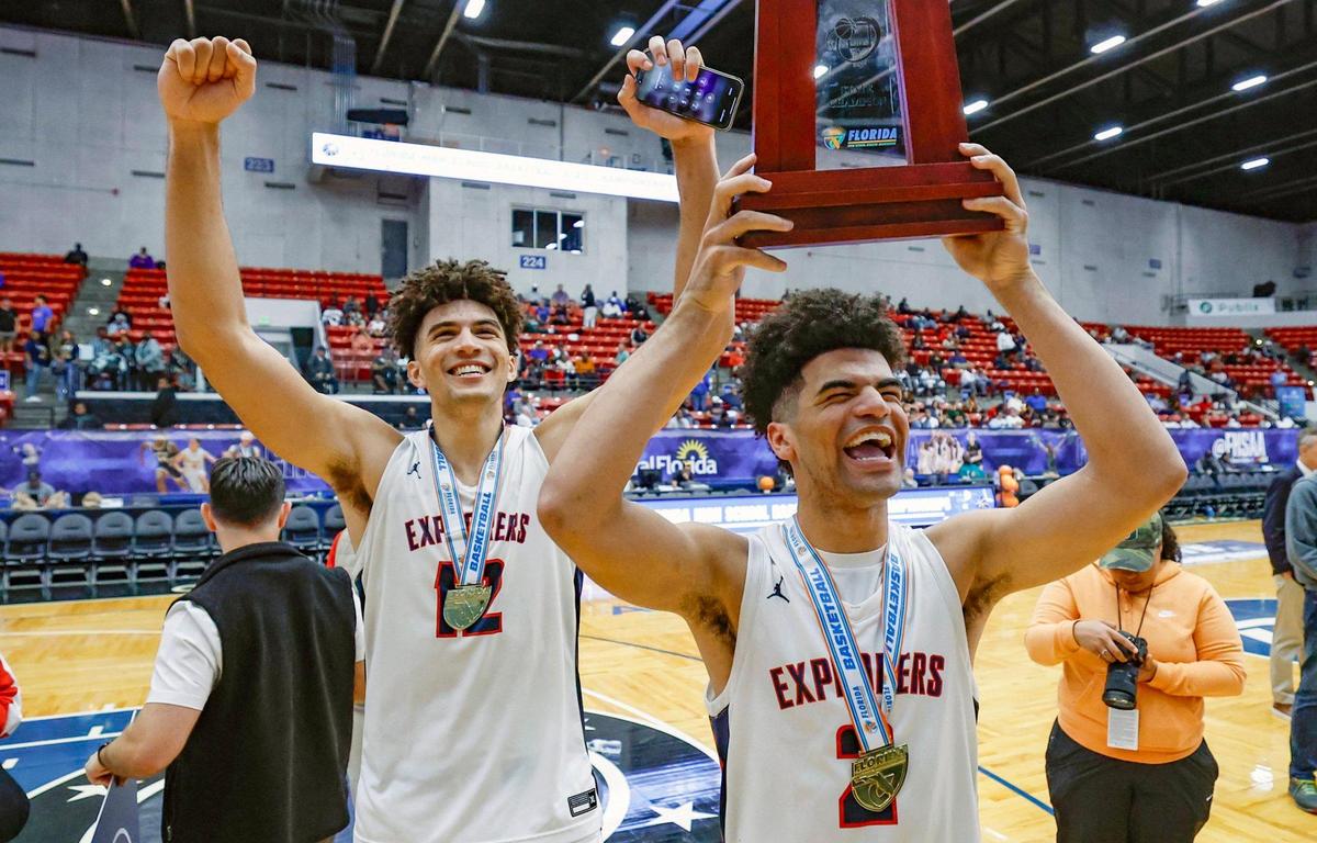 Columbus’ Cameron Boozer (12) and brother Cayden Boozer (2) celebrate after the team defeats Windermere for the FHSAA Class 7A Final for Boys High School Basketball State Championship at the RP Funding Center in Lakeland, Florida on Saturday, March 8, 2025.