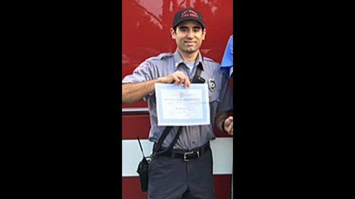 Vincent Vega, a former Key West firefighter, holds an award he received in 2016 for his work as a emergency medical technician. Vega was arrested March 14, 2025, after police say they found an illegally modified semiautomatic rifle in his car. They later found a pipe bomb, about 10,000 rounds of ammunition and explosives-making materials in his apartment, according to his arrest warrant.
