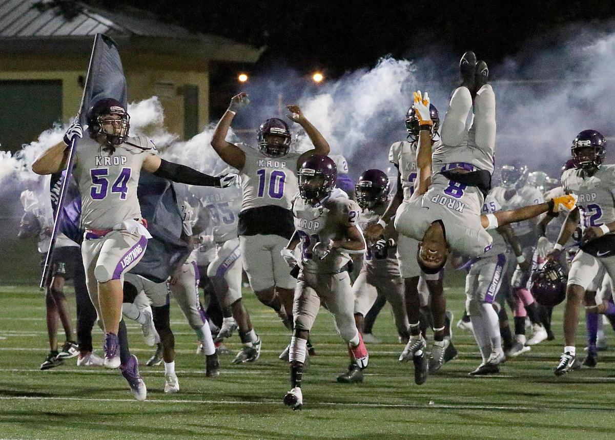 Dr. Michael M. Krop Lightning players take the field for a game against McArthur Mustangs on Friday, October 28, 2022 at Ives Estate Park in Miami. The Lightning won 20-16. Andrew Uloza / for Miami Herald