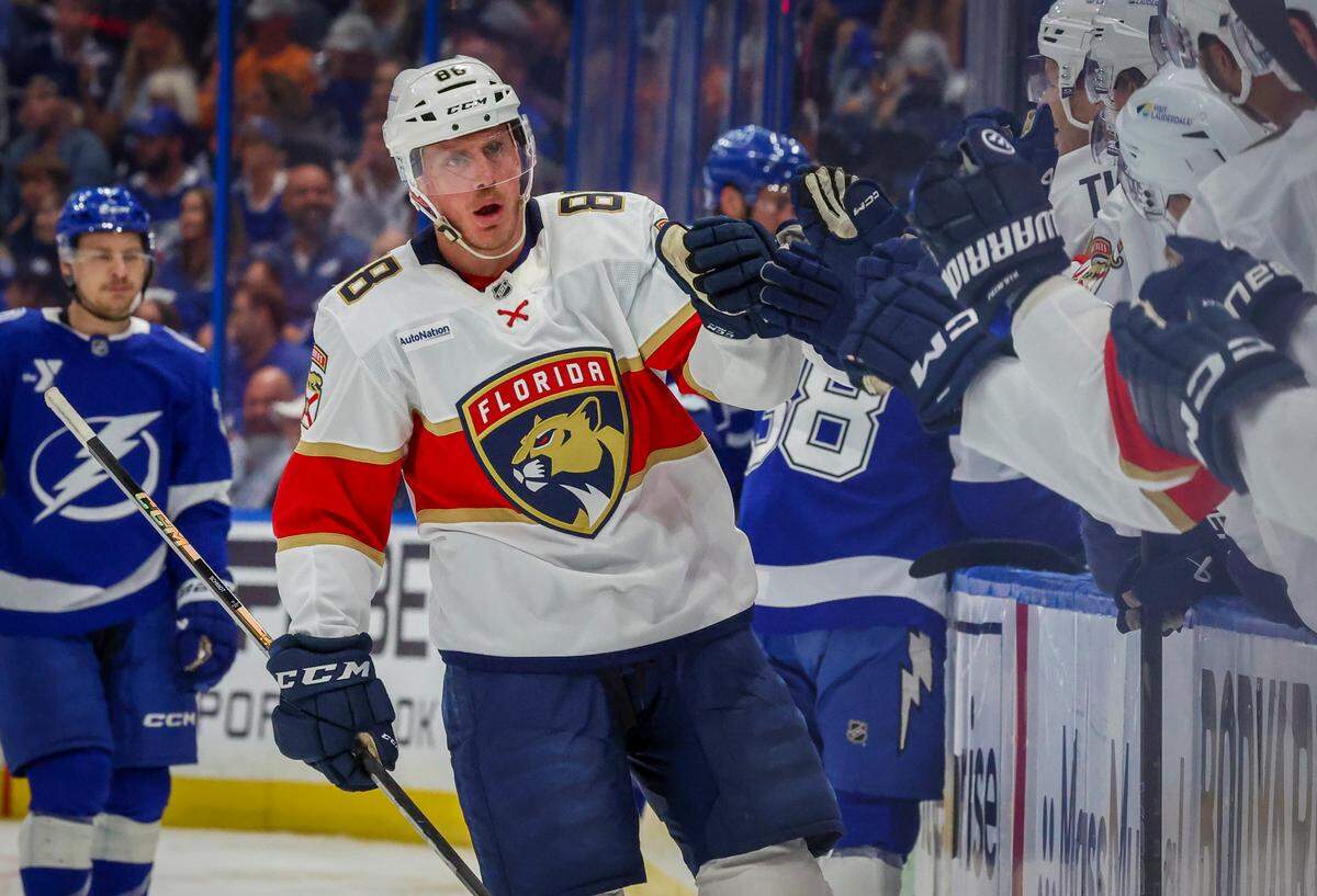 Florida Panthers defenseman Nate Schmidt (88) is congratulated after scoring in the first period against the Tampa Bay Lightning in Game 2 of the first round in the Stanley Cup Playoffs Thursday, April 24, 2025 in Tampa.