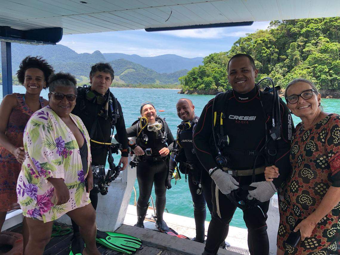 Some members of the research team and local community during a scuba diving expedition.