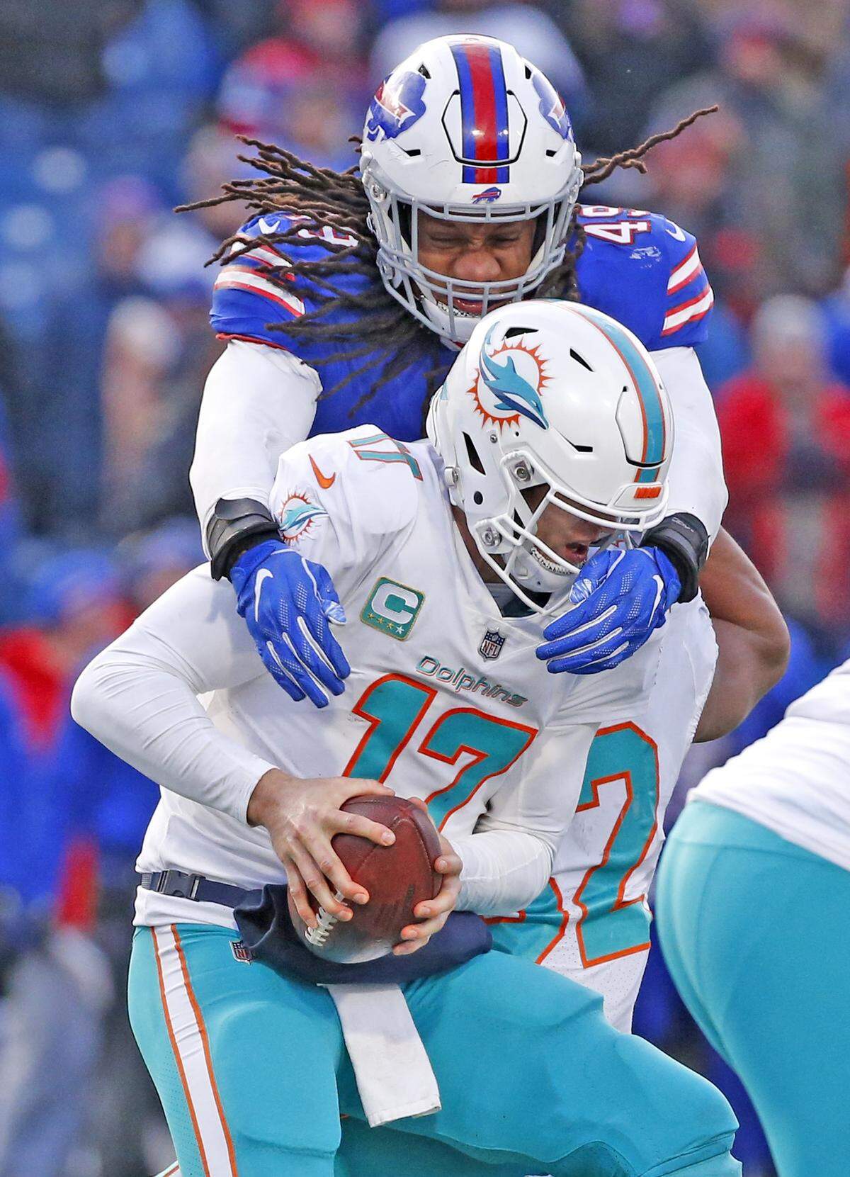 Miami Dolphins quarterback Ryan Tannehill (17) is sacked by Buffalo Bills middle linebacker Tremaine Edmunds (49) in the fourth quarter Sunday, Dec. 30, 2018, at New Era Field in Orchard Park, N.Y.