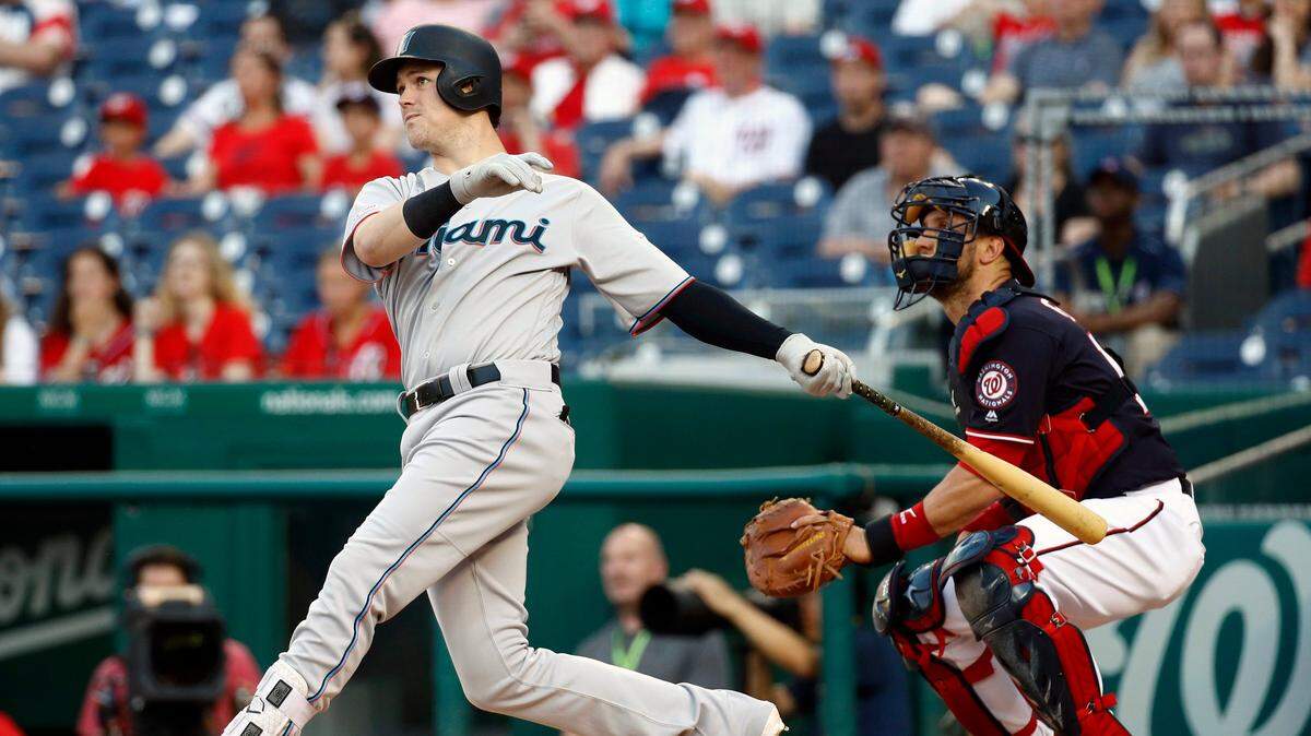 Miami Marlins’ Brian Anderson, left, watches his two-run home run in front of Washington Nationals catcher Yan Gomes in the first inning of a baseball game, Friday, May 24, 2019, in Washington. (AP Photo/Patrick Semansky)