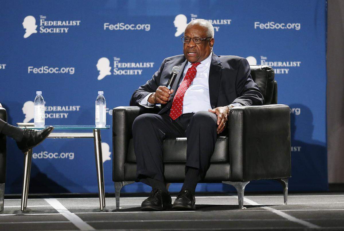 U.S. Supreme Court Justice Clarence Thomas talk during a interview session during the banquet program at the Federalist Society Florida Chapters Conference at Disney’s Yacht and Beach Club Resorts in Lake Buena Vista, Florida on Friday, January 31, 2020.