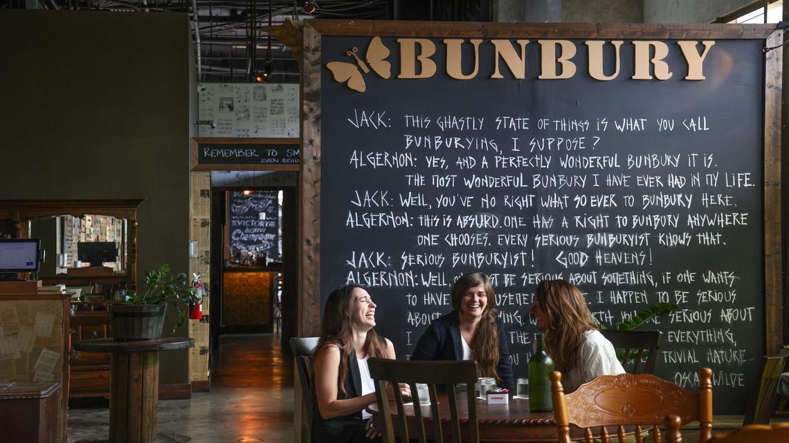 Geraldine Quintero and Paula Costa, owners of Bunbury, and hospitality manager Alina Patalino, right, share coffee and conversation at the Argentine restaurant.