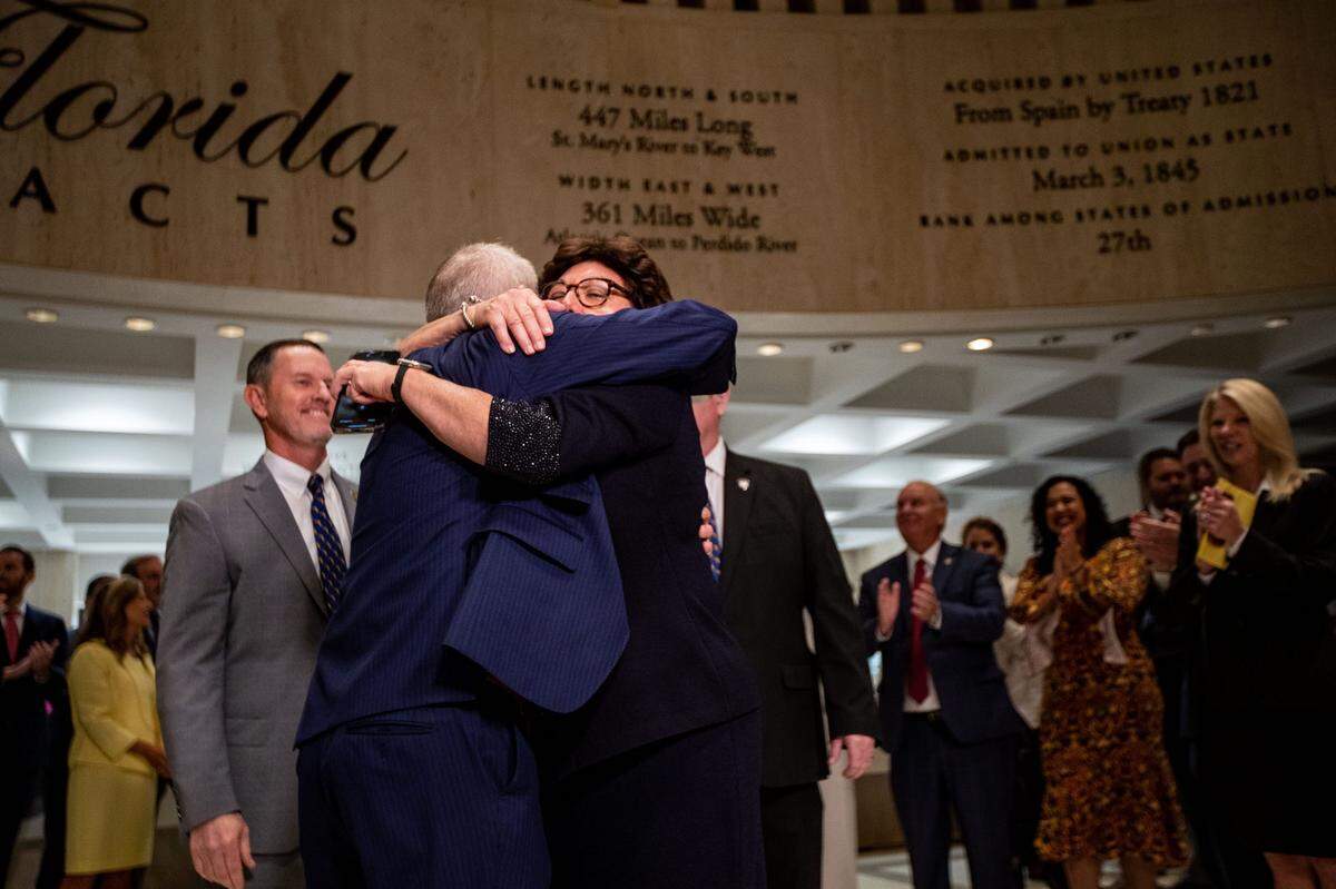 File art: Speaker of the House Paul Renner and Senate President Kathleen Passidomo embrace in the fourth floor rotunda at the close of the 2023 Florida legislative session, their first as leaders of their respective chambers.