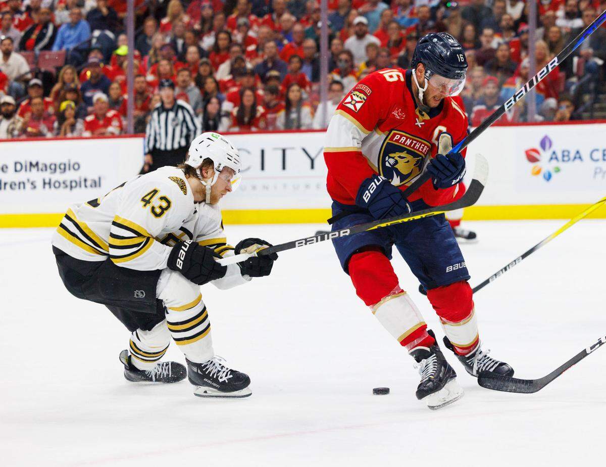 Florida Panthers center Aleksander Barkov (16) and Boston Bruins center Danton Heinen (43) go after the puck during the first period of Game 5 of a second-round Stanley Cup Playoff series on Tuesday, May 14, 2024, at Amerant Bank Arena in Sunrise, Fla.