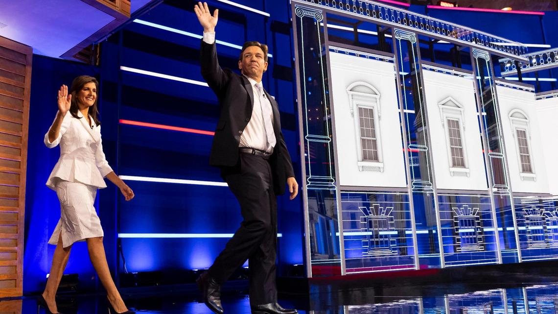 Former U.N. Ambassador Nikki Haley and Florida Gov. Ron DeSantis walk onto the stage during the third Republican presidential primary debate at the Adrienne Arsht Center for the Performing Arts of Miami-Dade County on Wednesday, Nov. 8, 2023, in downtown Miami, Fla.