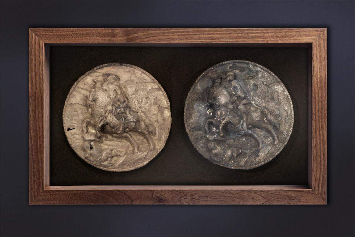 The plates are six inches in diameter, weigh about three quarters of a pound and are embossed with images of a mounted horseman (believed to be St. James), a castle-like structure in the background and a “prone figure surmounted by a crown bearing three crescent moons.”