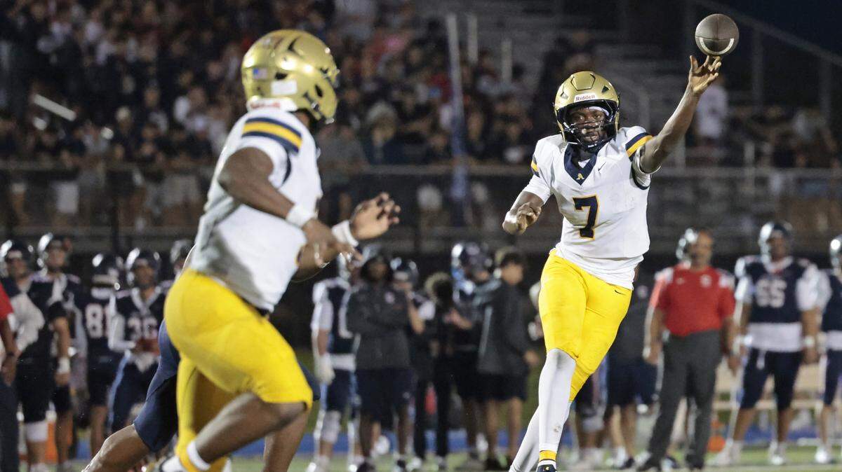 St. Thomas Aquinas quarterback Mason Mallory (7) throws a touchdown pass to running back Jaden Desir (3) during the game against the Columbus Explorers in the first half at Tropical Park Stadium in Miami, Florida, on Friday, September 5, 2025. 
