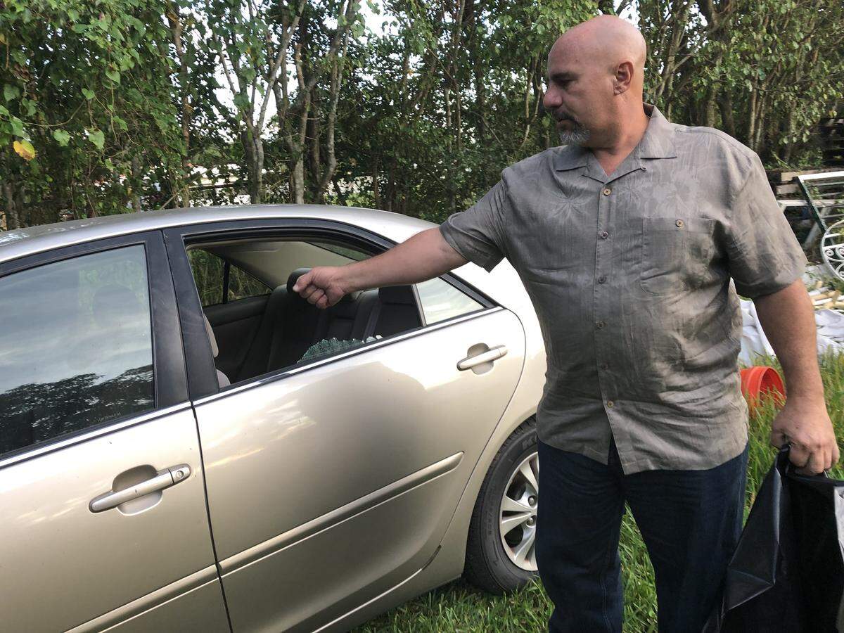 Nick Humet stands with the car his brother Jaime Humet was killed in Dec. 19, 2018. Jaime Humet was killed Dec. 10, 2018, and police are still looking for his killer.