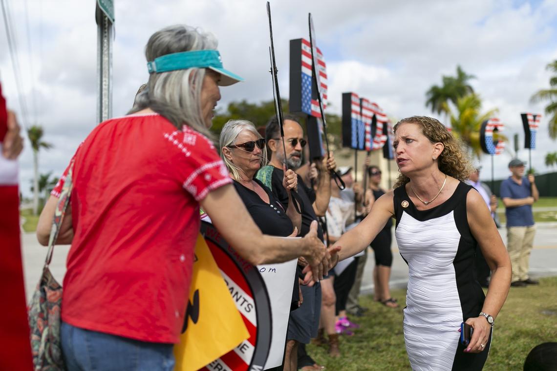 Rep. Debbie Wasserman Schultz (D-FL) shakes hands with activists after she was denied entrance to the Homestead Temporary Shelter for Unaccompanied Migrant Children by the Trump administration in Homestead, Florida on Monday, April 8, 2019.