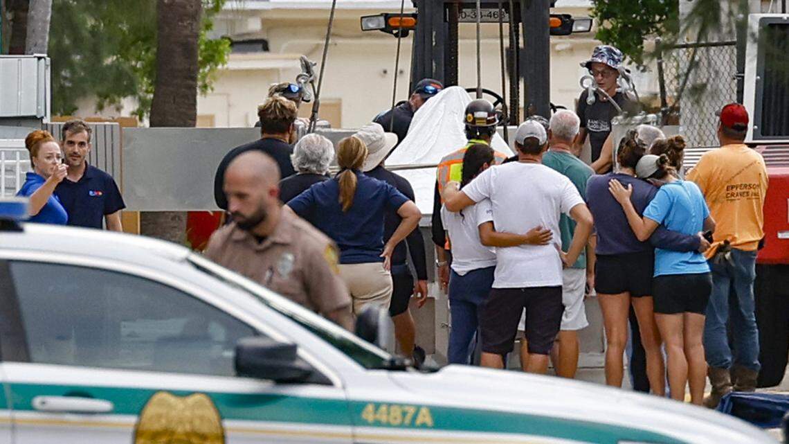Onlookers mourn Lolita, the orca who lived in captivity for five decades, after she died at the Miami Seaquarium in Miami on Friday, Aug. 18, 2023.