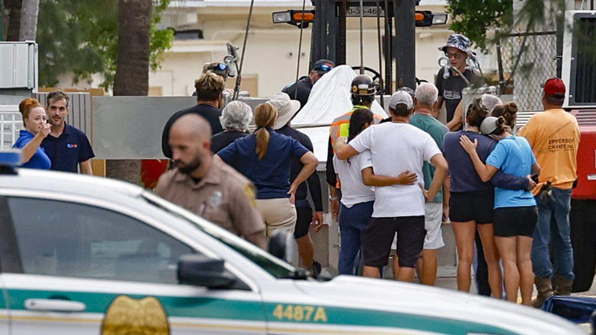 Onlookers mourn Lolita, the orca who lived in captivity for five decades, after she died at the Miami Seaquarium in Miami on Friday, Aug. 18, 2023.