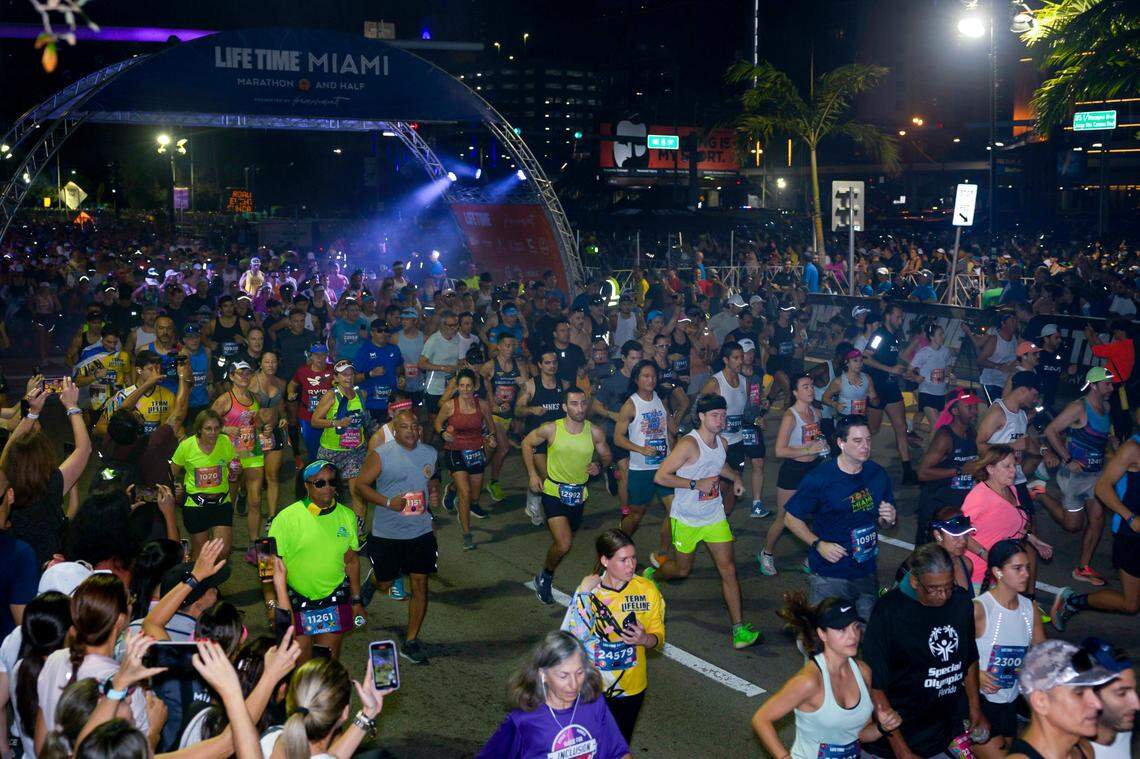 Runners begin the Life Time Miami Marathon and Half on Sunday, Jan. 28, 2024, finishing at Bayfront Park in downtown Miami.