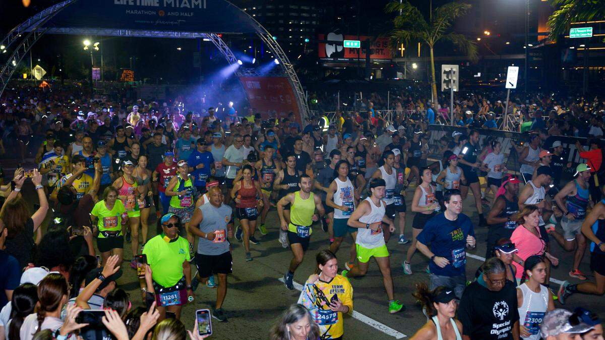 Runners begin the Life Time Miami Marathon and Half on Sunday, Jan. 28, 2024, finishing at Bayfront Park in downtown Miami.