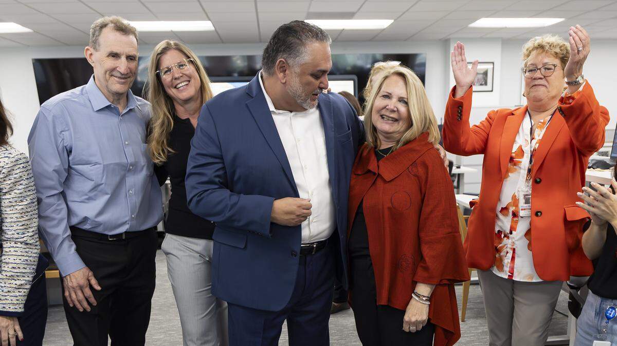 From left to right: Former Miami Herald Investigations Editor Casey Frank, former Miami Herald Photojournalist Emily Michot, Miami Herald Executive Editor Alex Mena, Investigative Reporter Julie K. Brown, and Miami Herald Managing Editor Dana Banker celebrate at the Miami Herald office on Monday, May 4, 2026. Brown was honored for her 2018 investigation, Perversion of Justice, focusing on Jeffrey Epstein.