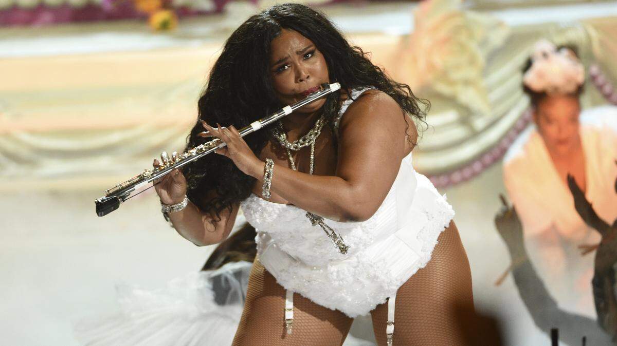 This June 23, 2019 file photo shows Lizzo playing the flute at the BET Awards in Los Angeles.