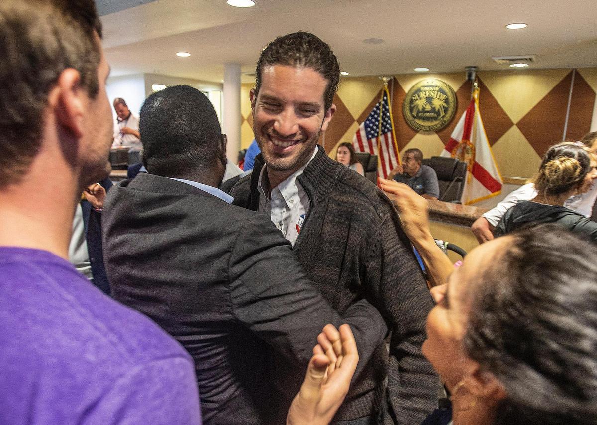Shlomo Danzinger celebrates at Surfside Town Hall on Tuesday after winning the mayoral election. He defeated Mayor Charles Burkett and Vice Mayor Tina Paul.