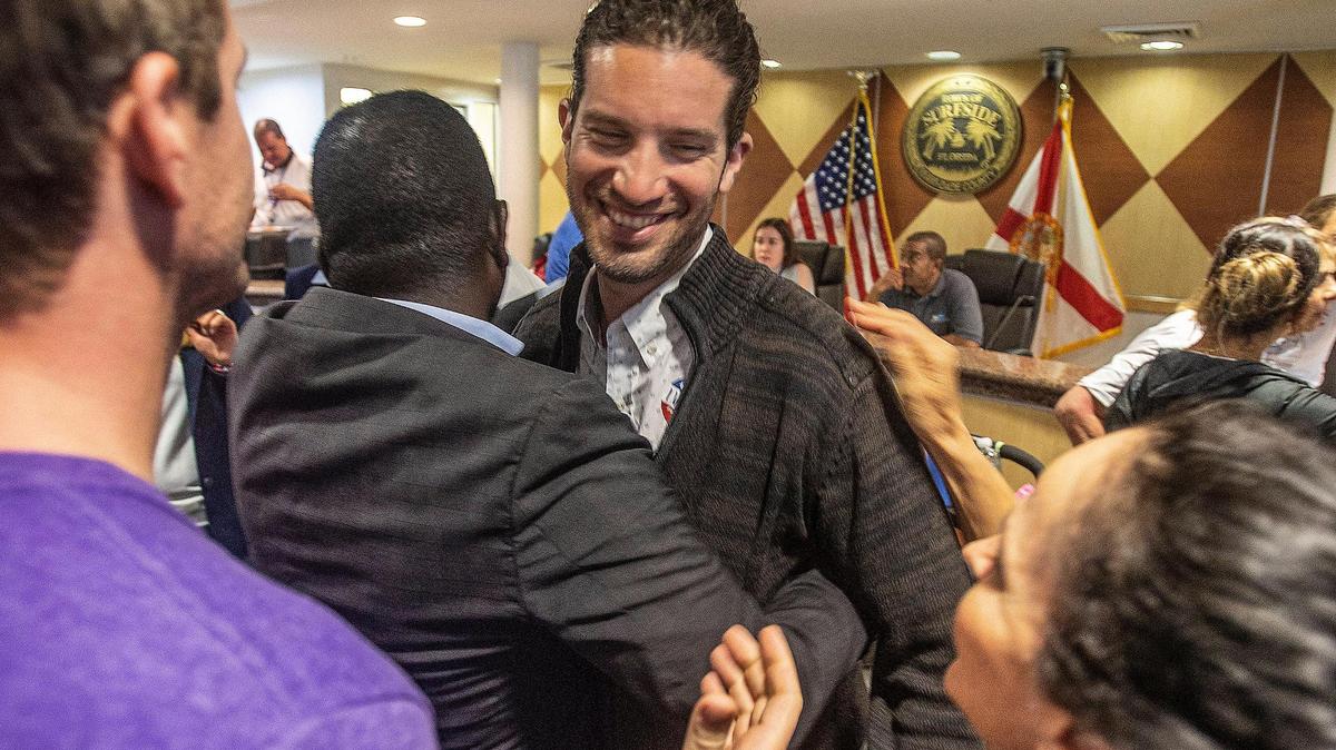 Shlomo Danzinger celebrates at Surfside Town Hall on Tuesday after winning the mayoral election. He defeated Mayor Charles Burkett and Vice Mayor Tina Paul.