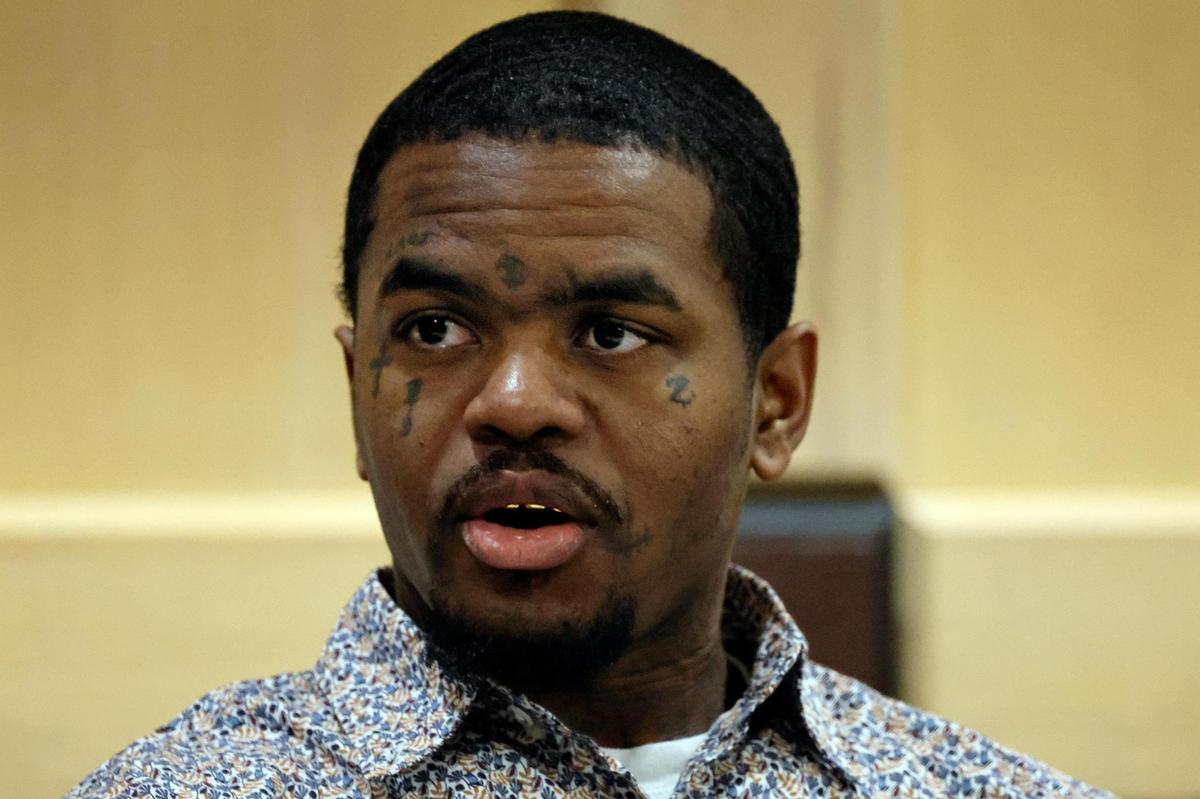 Suspected shooting accomplice Dedrick Williams speaks to someone in the courtroom gallery as attorneys meet with Judge Michael Usan for a sidebar discussion during closing arguments in the XXXTentacion murder trial at the Broward County Courthouse in Fort Lauderdale on Tuesday, March 7, 2023.