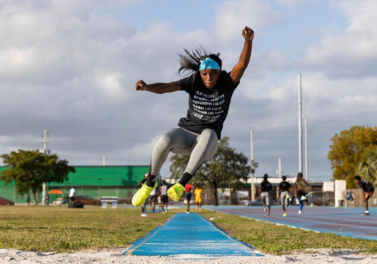 Emani Perry, 17, a member of the Miami Northwestern Senior High track and field team, practices her long jump at her school on Wednesday, Feb. 8, 2023, in Miami, Fla.