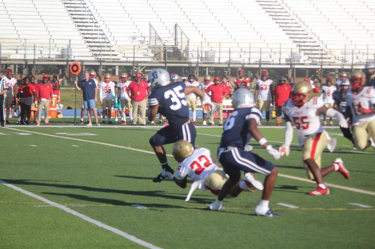 Gulliver Prep. running back Jack Whitehouse breaks loose for a 27-yard touchdown run in the first quarter of their game against Miami Monsignor Pace on Friday at Tropical Park.