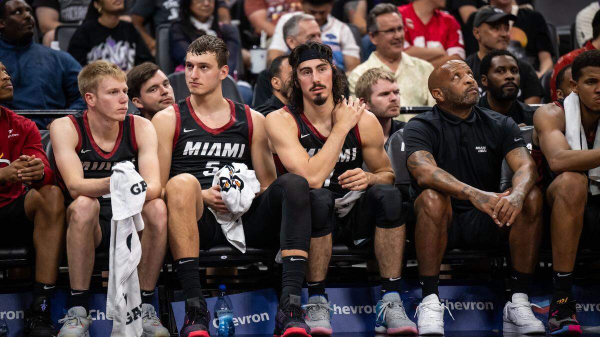 Miami Heat forward Jaime Jaquez Jr. (11), center, sits next to forward Nikola Jovic (5) during the first half of their California Classic NBA summer league basketball game against the Sacramento Kings on Wednesday, July 5, 2023, at Golden 1 Center.