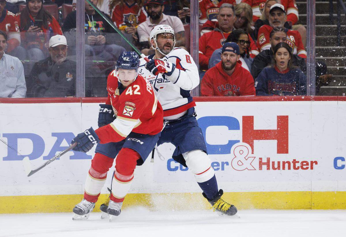 Washington Capitals left wing Alex Ovechkin (8) collides with Florida Panthers defenseman Gustav Forsling (42) during the second period of a game on Thursday, Nov. 13, 2025, at Amerant Bank Arena in Sunrise, Fla.