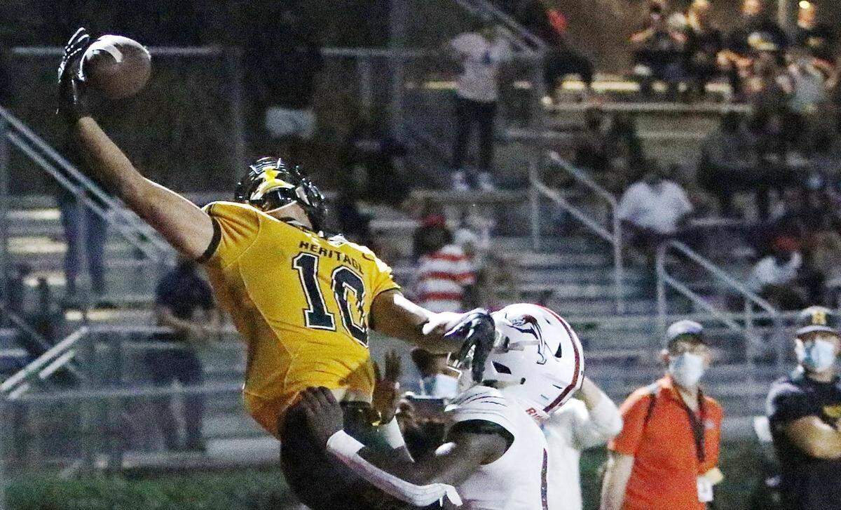 American Heritage Patriots wide receiver Oronde Gadsden (10) tries to catch a pass during the football game against Chaminade-Madonna Lions Friday, September 17, 2020 in Hollywood