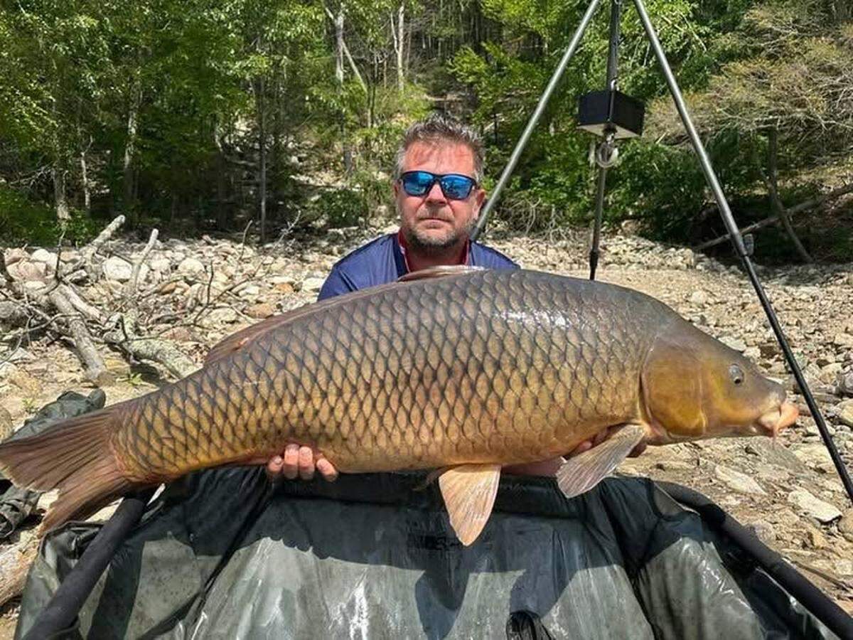 Norbert Samok with the carp he caught at Lake Zoar in Connecticut on June 21.