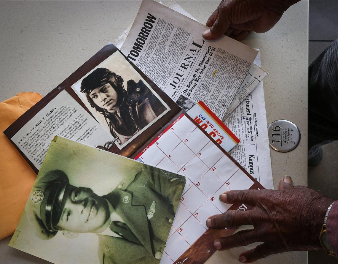 Air Force veteran Leonard Hopkins, 90, shares a photo of himself, and his cousin, a fellow Tuskegee airman pictured on a calendar, as Black military veterans gathered daily to share memories, stories, and fellowship at a local McDonald’s on Thursday, March 28, 2024 in Miami, Florida.