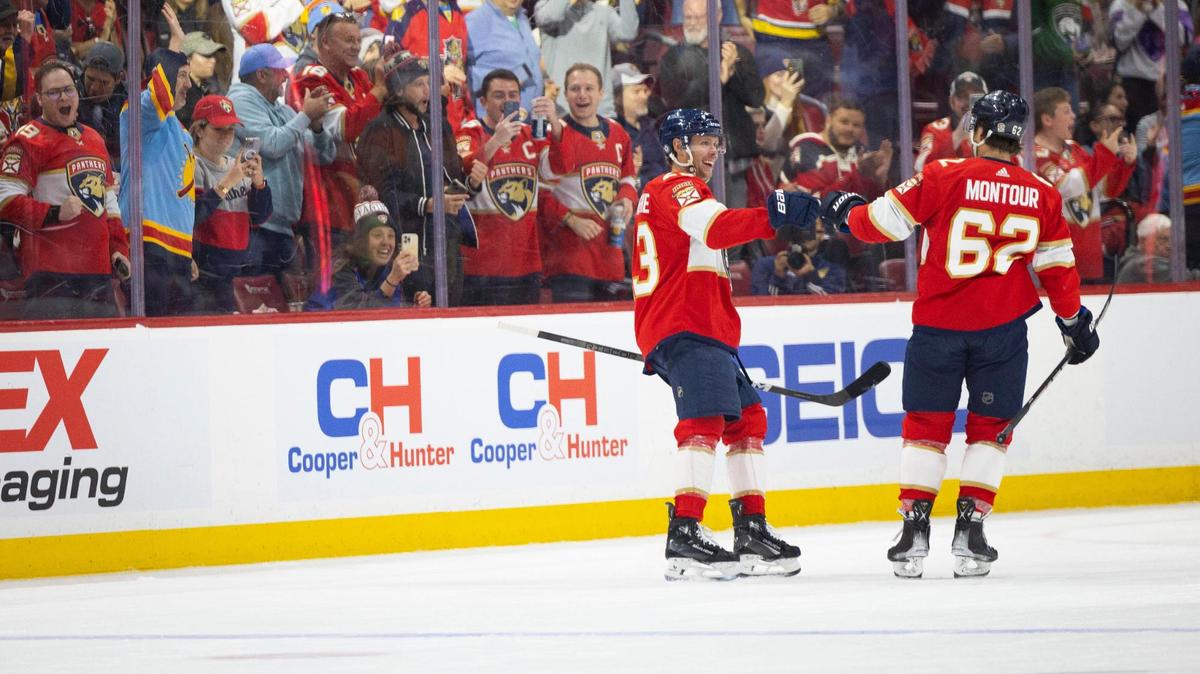Florida Panthers center Carter Verhaeghe (23) fist bumps Florida Panthers defenseman Brandon Montour (62) to celebrate Verhaeghe’s goal during the first period of a hockey game on Tuesday, Feb. 6, 2024, at Amerant Bank Arena in Sunrise, Fla.