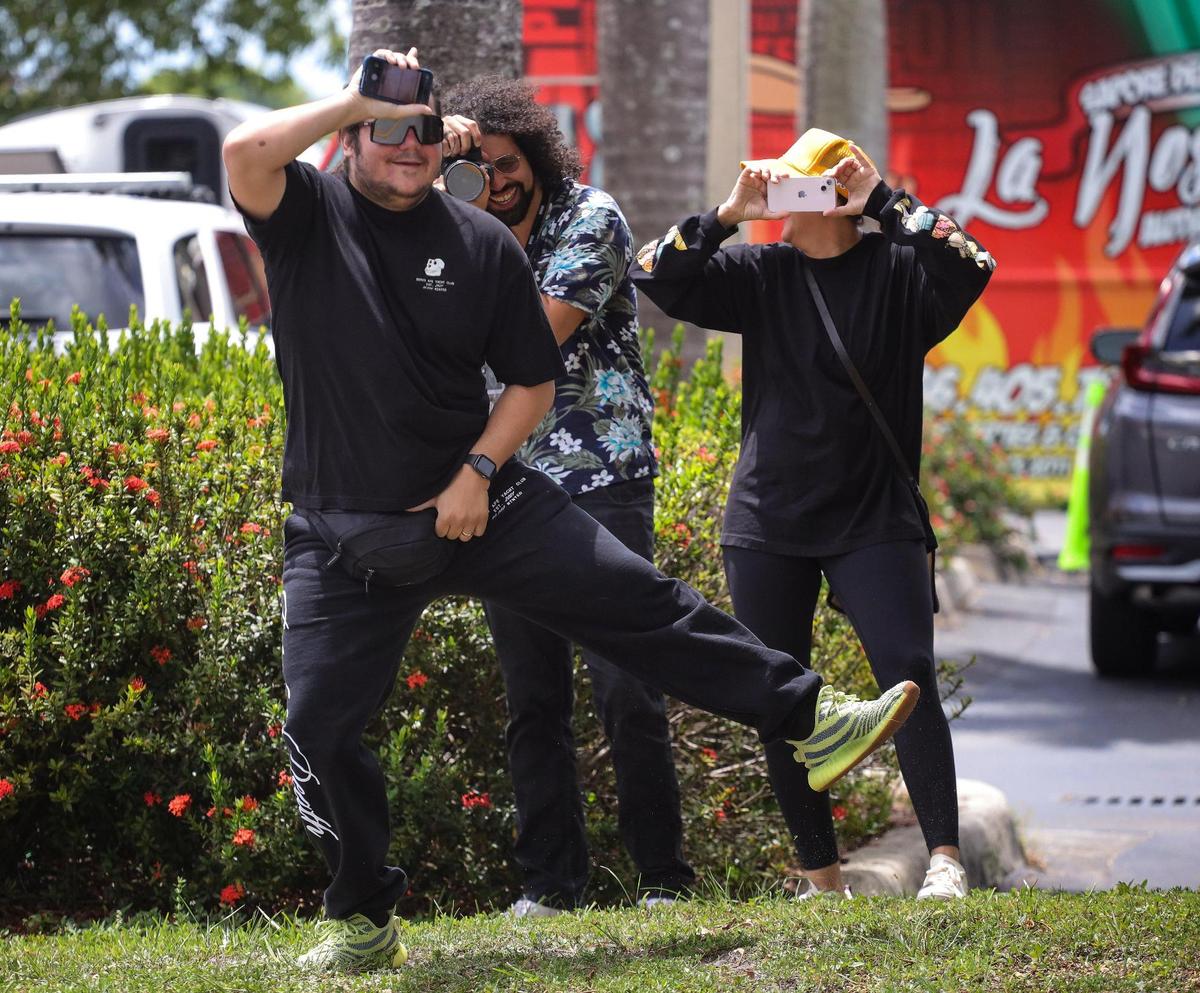 Supporters of Gov. Ron DeSantis mock protesters with a dance on Sunday, August 21, 2022 outside Metro-Dade Firefighters Local 1403 in Doral, Florida, where DeSantis spoke at a campaign event in support of school board candidates he endorsed.