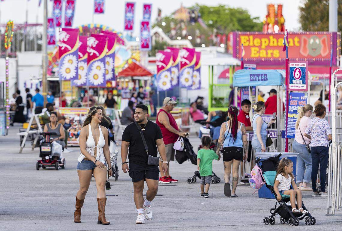 Guests make their way through the fairgrounds during the opening day of the 74th annual Miami-Dade County Youth Fair on Thursday, March 12, 2026, in Miami, Fla.