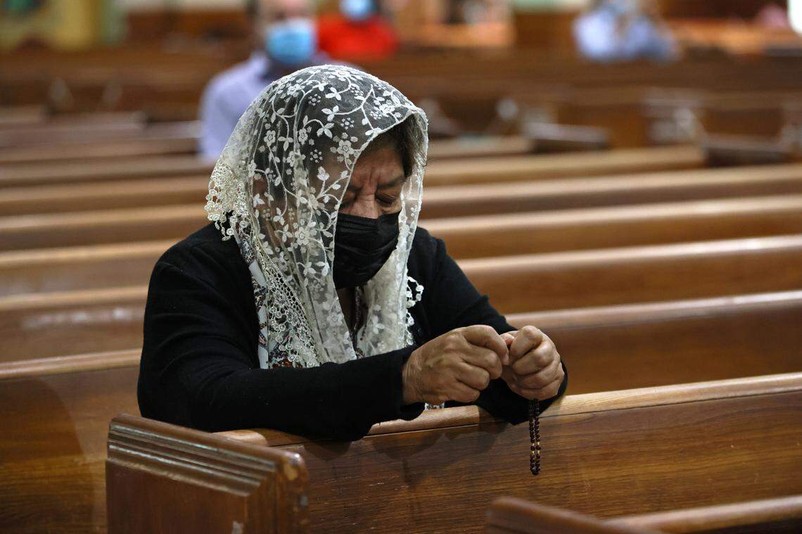 Sonia Rivas prays during Sunday Mass at St. Joseph’s Catholic Church in Miami Beach on June 27, 2021, held in honor of the victims of the Surfside condo collapse. The condo tower partially collapsed on Thursday, June 24, 2021.