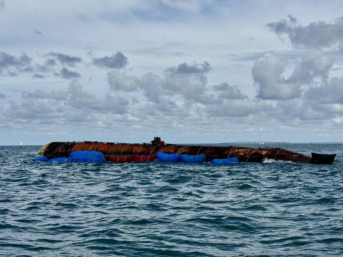 A derelict 96-foot yellow submarine floats on the surface of the ocean off Marathon in the Middle Florida Keys Monday, Aug. 11, 2025.