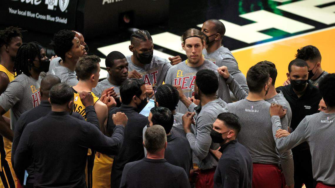 Miami Heat head coach Erik Spoelstra talks with his team before the start of their NBA basketball game against the Orlando Magic at AmericanAirlines Arena on Thursday, March 11, 2021.