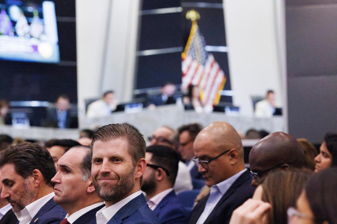 Eric Trump, left, attends a City of Doral council meeting on Wednesday, Jan. 15, 2025, at City Hall in Doral, Fla., for the final vote on the Trump Organization’s latest real estate venture in South Florida. The council approved unanimous the development project.