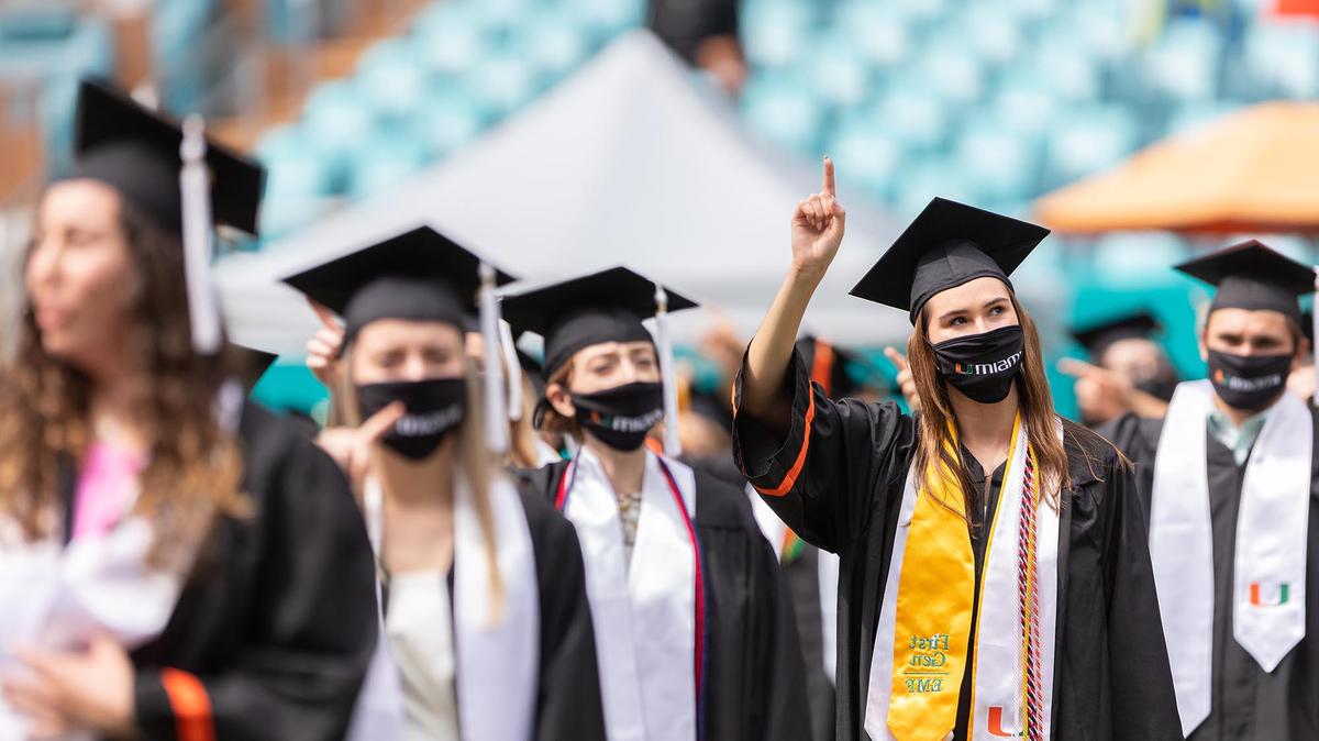 Students pose at one of the commencement ceremonies of the University of Miami held at the Hard Rock Stadium in Miami Gardens on Friday, May 14, 2021.