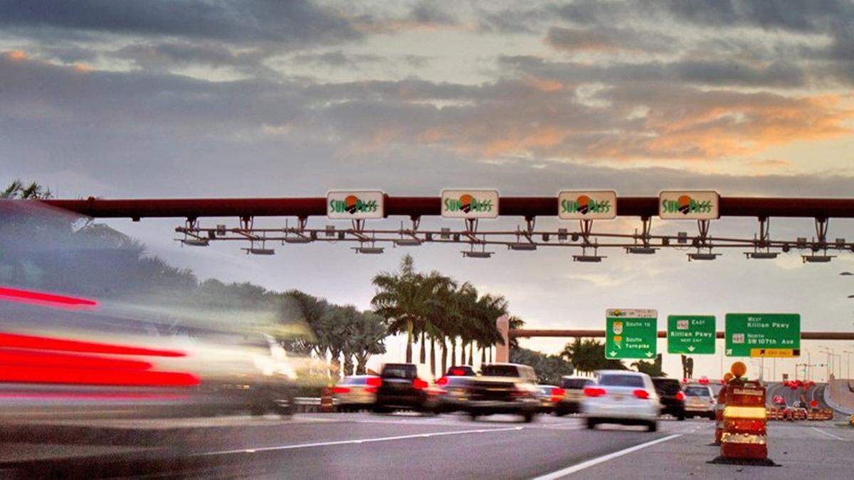 Evening rush hour traffic heads through the SunPass/ Toll-by-Plate area near Killian Parkway near the Turnpike extension.