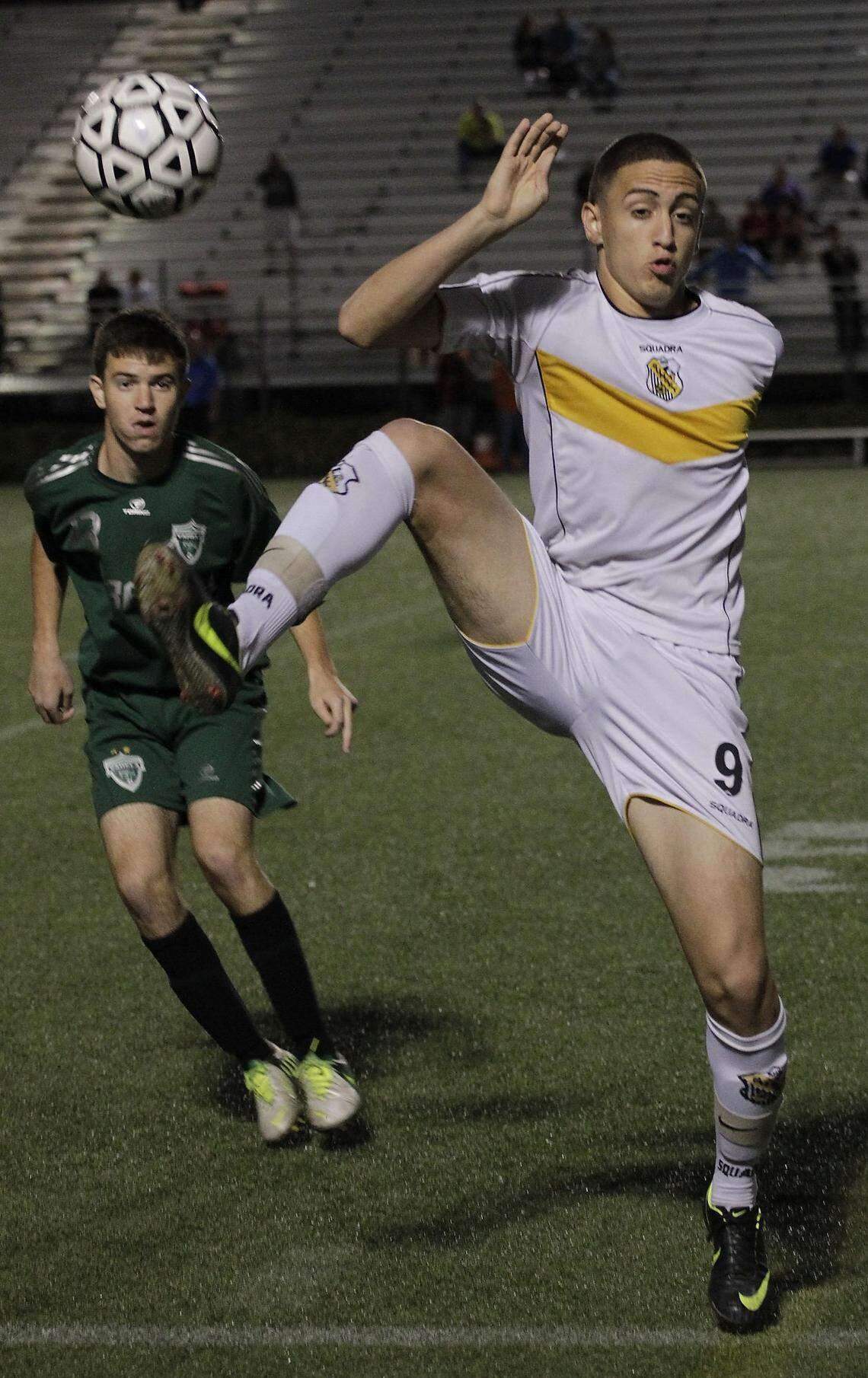 Miami Sunset player Eddy Pineiro, right, tries to trap the ball as Varela player Christian Santillan looks on. The score 2-2 at the half. Sunset High battled against Varela High School in the GMAC boys’ soccer at Milander Park in Hialeah, Floridaon Thursday, January 17, 2012.