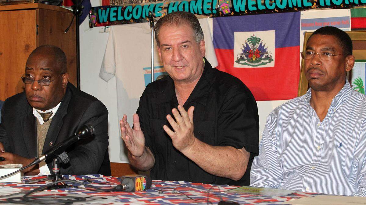 In 2011, Jack Lieberman, center, with the Haiti Solidarity Committee, joins Jean Lafortune, chairman of the Haitian-American Grassroots Coalition, left, and Jean Marcellus, vice mayor of North Miami in Little Haiti during a press conference discussing the arrival in Haiti of former president Jean-Claude “Baby Doc” Duvalier.