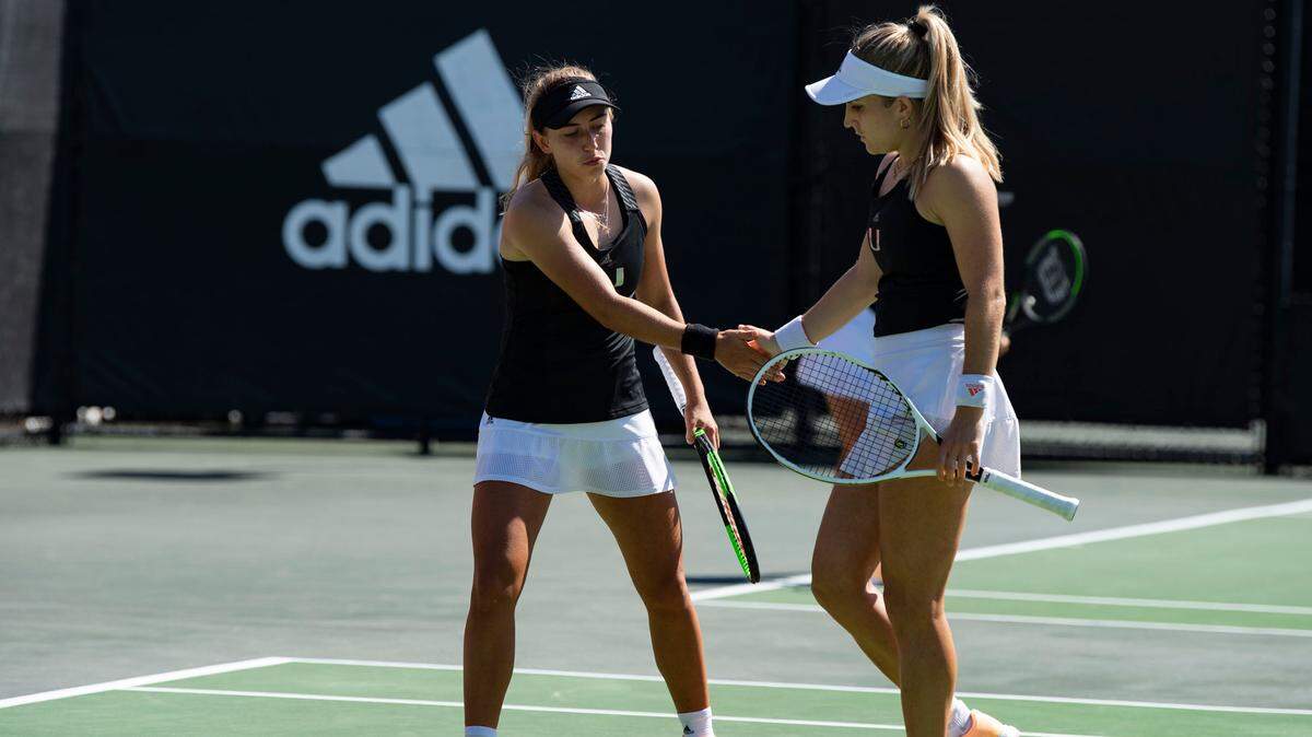 University of Miami Hurricanes tennis players Estela Perez-Somarriba, right, and Isabella Pfennig.