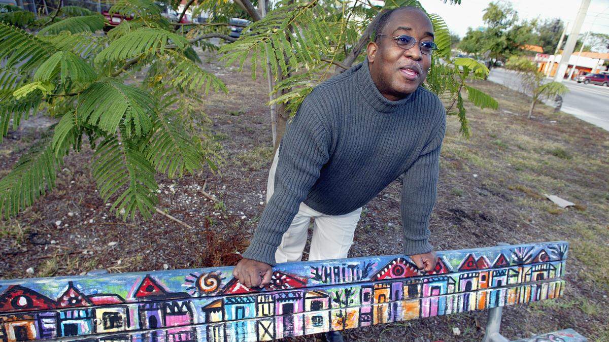 In this Jan. 1, 2005 photo, Jean-Robert Lafortune talks about the group’s plans for the renovation of Haitian Freedom Garden (Place Kamoken in Creole) at the southwest corner of Miami Avenue and Northwest 62nd Street. (MARIANNE ARMSHAW/For The Herald)