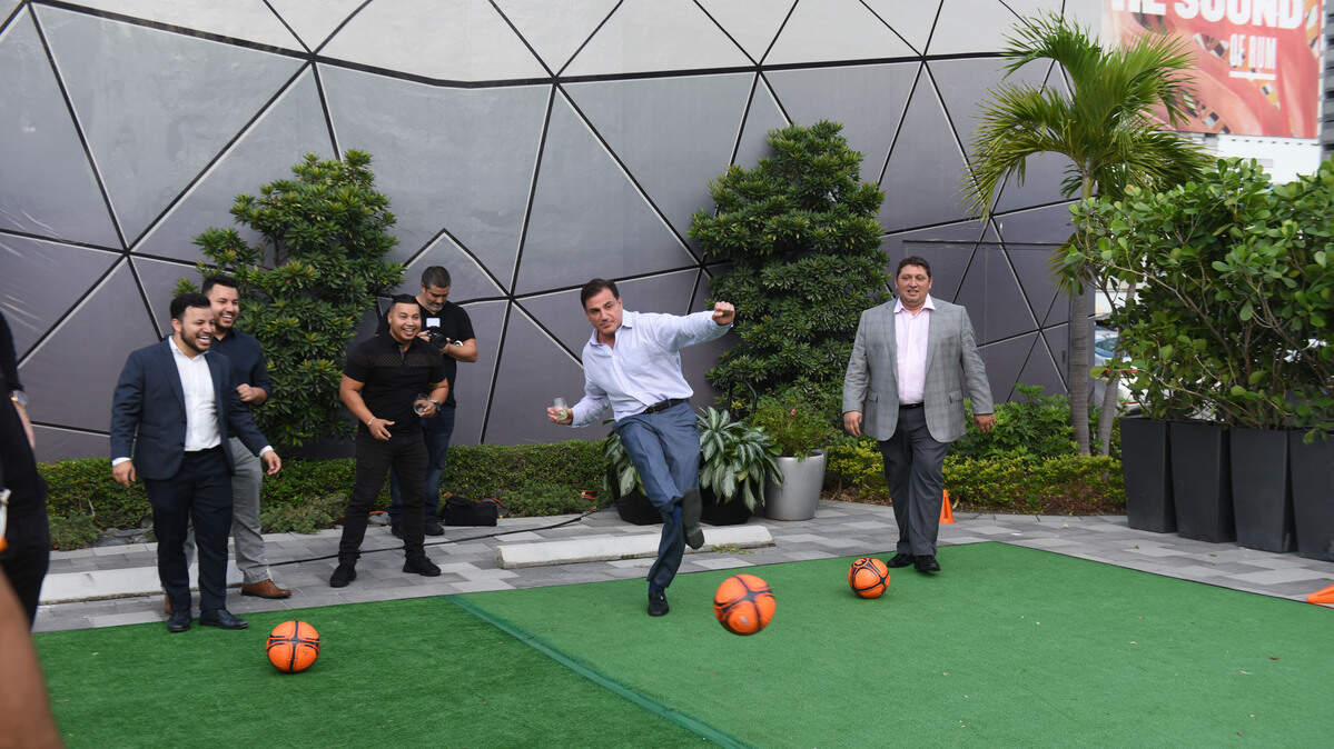 Developer Dan Kodsi takes a shot on goal during a World Cup fundraiser at the Paramount Miami Worldcenter sales center on June 13